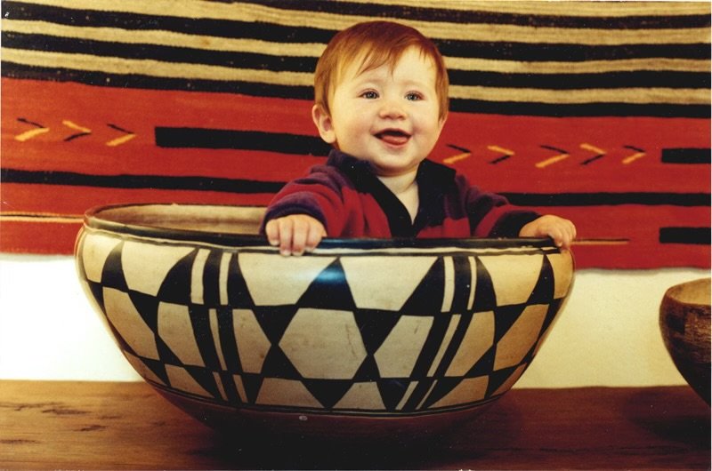 Charles Sublette as a child, sitting in a large pottery bowl